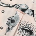 Close up photo of Blinky Bills Shirt No. 2 hook detail. Very light pink short-sleeved shirt with print of different tattoo designs in greyscale.