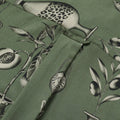 Close up photo of Blinky Bills Shirt No. 3 back hook detail. Olive green short-sleeved shirt with print of tattoo designs of different vases.