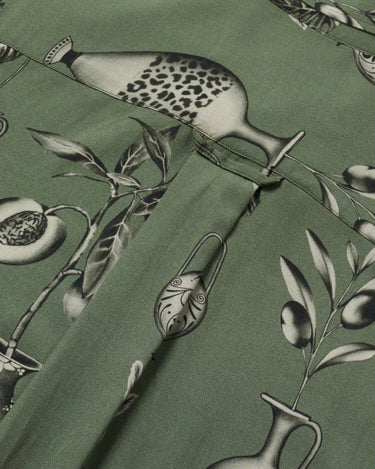 Close up photo of Blinky Bills Shirt No. 3 back hook detail. Olive green short-sleeved shirt with print of tattoo designs of different vases.