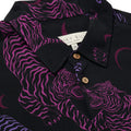 Close up photo of Blinky Bills Shirt No. 1 collar on white background. Black short-sleeved shirt with print of purple and pink tiger tattoo designs.